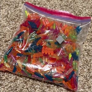 Zip lock bag full of colorful LightBright pegs